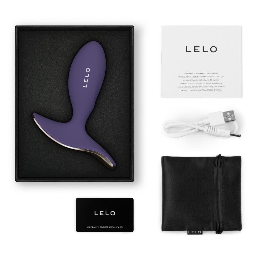 Plug anal Surfer 2 violet pose dans son coffret avec cable, manuel, carte de garantie et pochette noire, set complet Lelo en silicone etanche rechargeable.