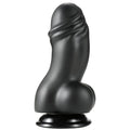 Gode XXL en PVC noir vu de face, gland charnu et bourses moulees sur ventouse, fut large et veine pour une presence interne intense et tres realiste.