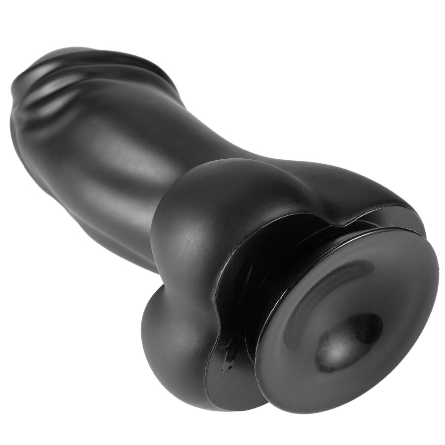 Gode XXL en PVC noir couche revelant la grande ventouse et le fut courbe a gland marque, angle bas mettant en avant la base adhesive pour mains libres.