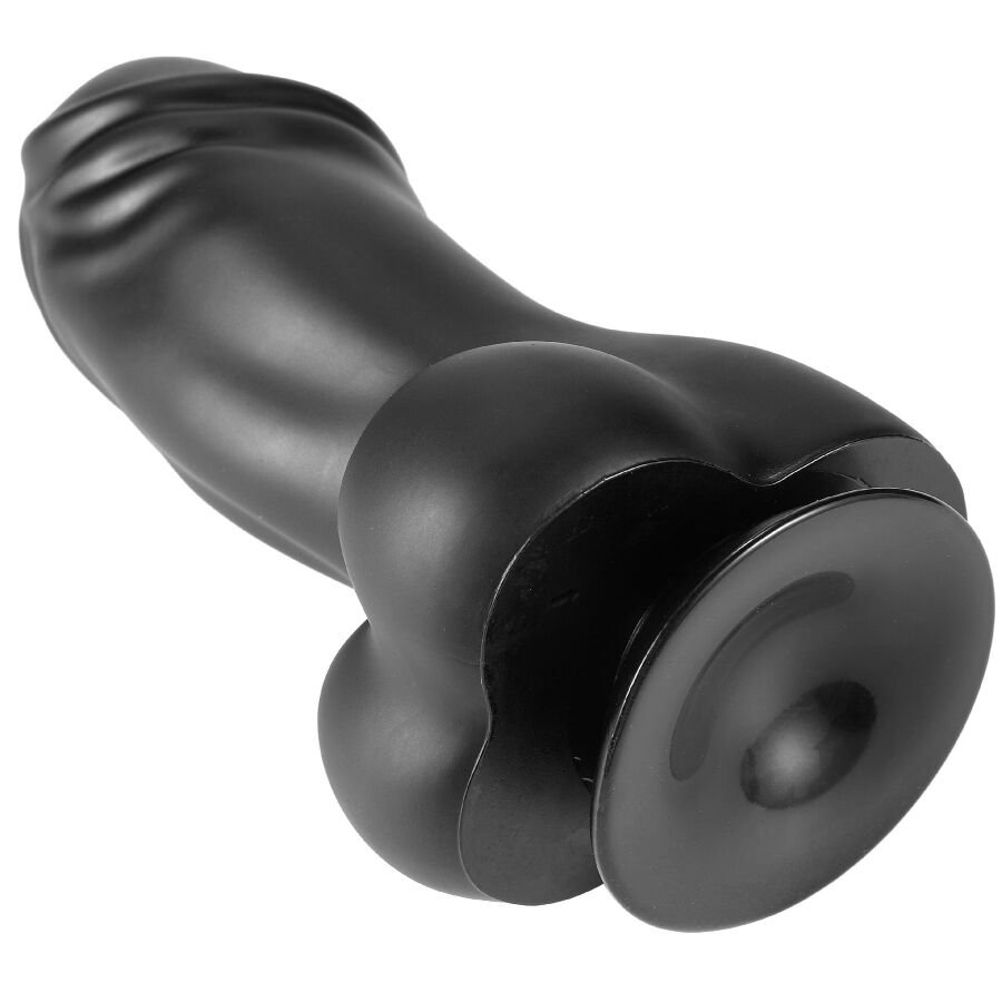Gode XXL en PVC noir couche montrant la ventouse circulaire et le fut courbe a gland, angle mettant en valeur la fixation adhesive pour un usage mains libres.