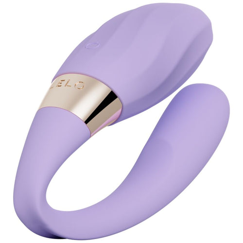 Stimulateur de couple Lelo Tiani Twist lilas en forme de U a porter, deux branches en silicone souple et bandeau dore central, masseur connecte a porter a deux.