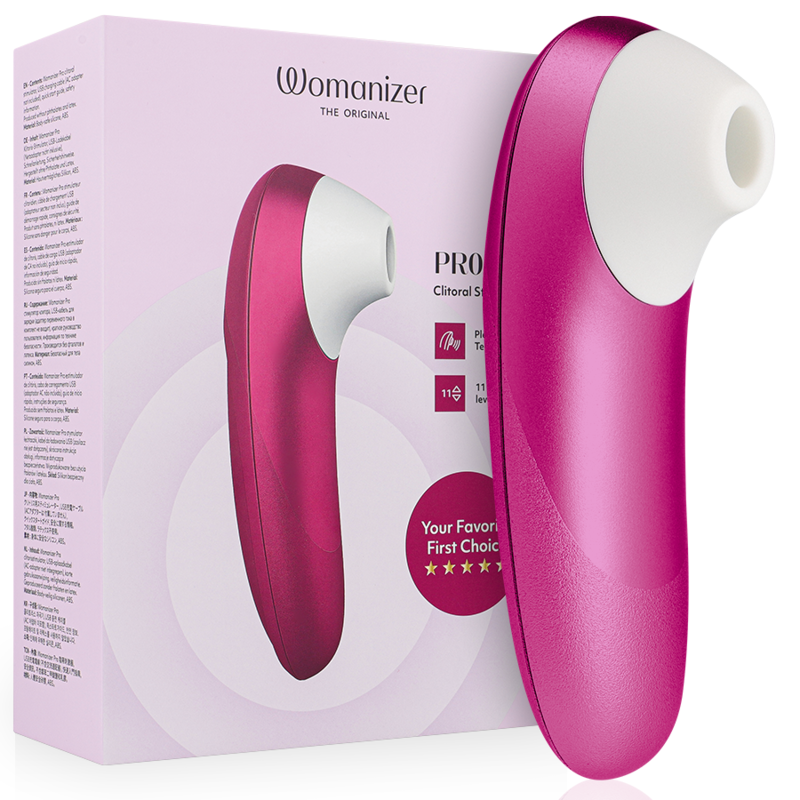 Boîte Womanizer 'Pro' rose à gauche et stimulateur clitoridien rose vif à droite : embout de succion blanc et corps galbé lisse, étoiles 'first choice', sans anatomie.