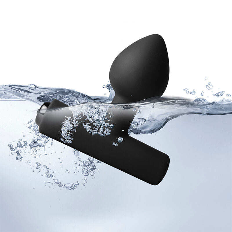 Plug vibrant Nova Astryx noir à moitié immergé, éclaboussures d'eau