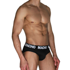Slip noir MACHO MCH007 porté de profil, ceinture logo MACHO blanche