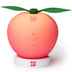 Stimulateur clitoridien par succion Peche ROMP au design de fruit corail sur son socle, technologie d'air pulse enveloppant le clitoris sans contact direct.