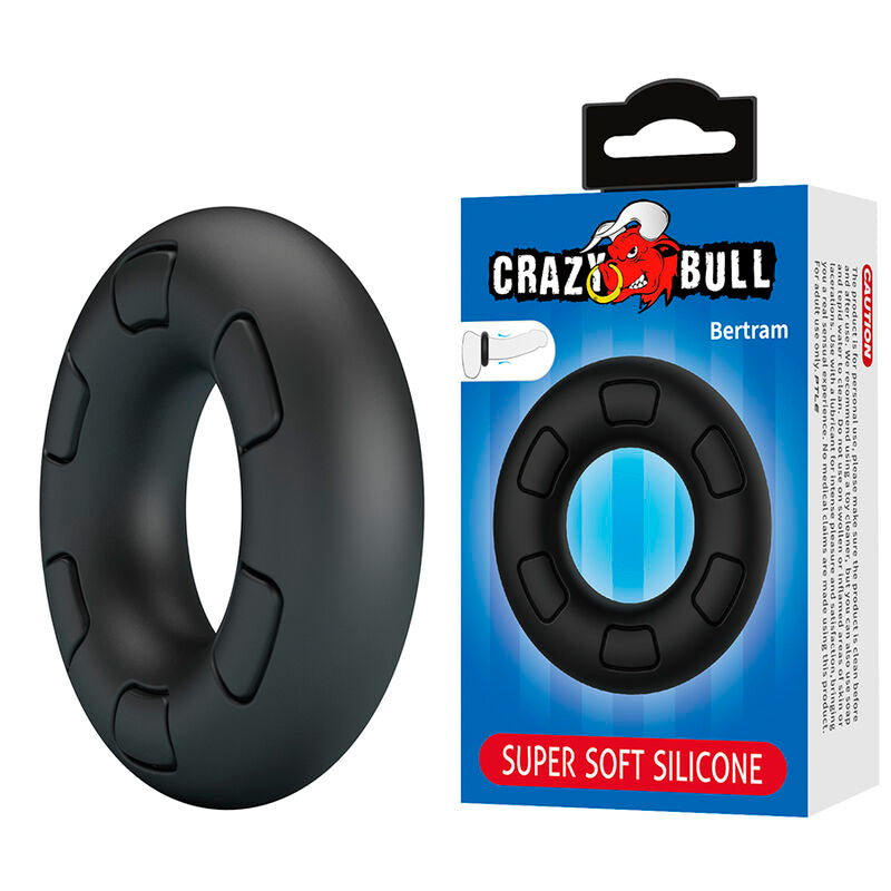 Anneau pénien Bertram noir posé à côté de son emballage Crazy Bull