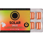 Emballage ouvert du chewing-gum WUG Solar laissant apparaître la plaquette de 8 gommes orange