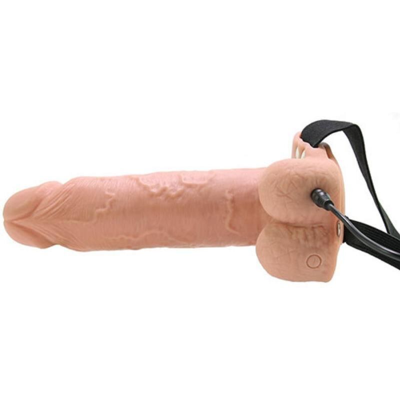 Gros plan sur les boules et le bouton de vibration du gode ceinture creux Fetish Fantasy Series