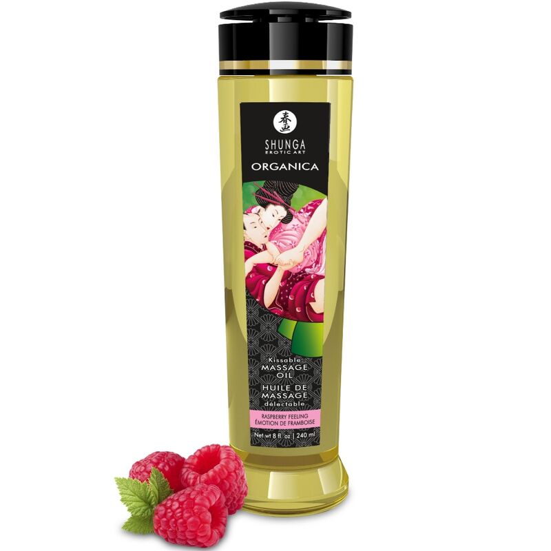 Flacon d'huile de massage Shunga Organica saveur framboise, avec des framboises fraîches posées devant