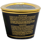 Dos de la boîte de bougie de massage Shunga avec mode d'emploi multilingue ; le couvercle visible porte la mention « Zenitude - Exotic Green Tea », un parfum différent de celui de cette fiche (mangue)