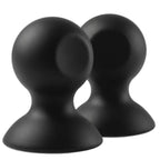 Ventouses en silicone noir, vue de trois quarts laissant apparaître la base creuse de l'une d'elles