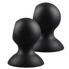 Deux ventouses en silicone noir, vue de profil légèrement inclinée