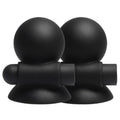 Paire de ventouses à tétons noires She.E.O, vue de face montrant la bille de préhension et la base ventouse