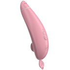 Womanizer Premium Eco rose vu de trois quarts, boutons de commande et languette de protection visibles.