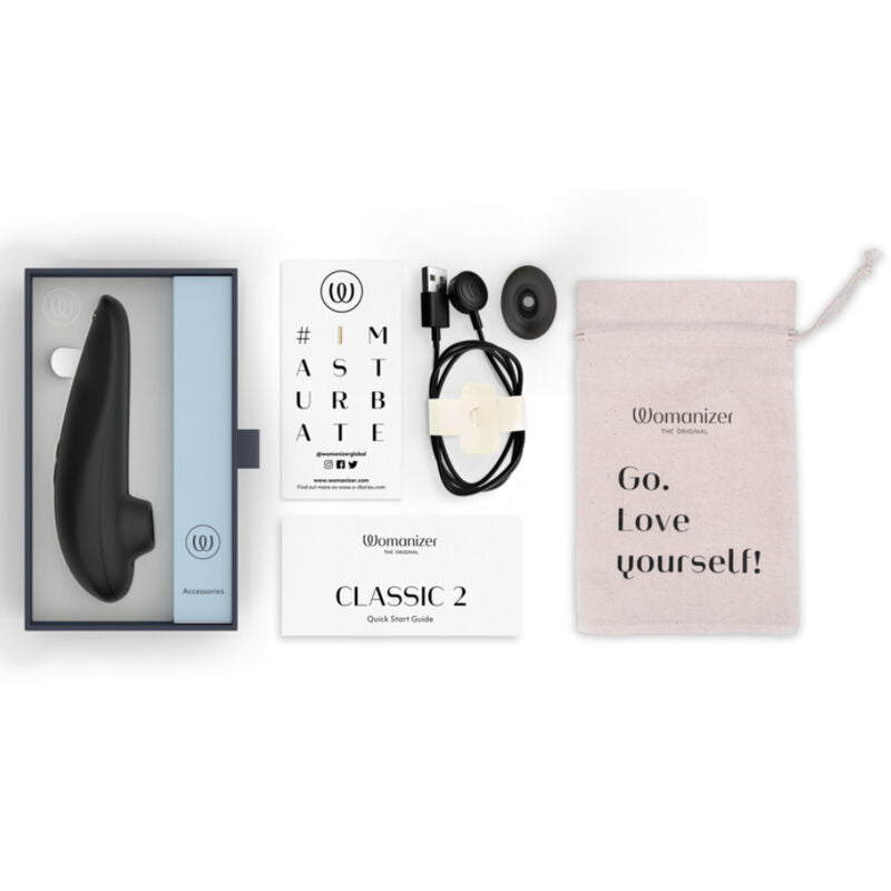 Coffret du Womanizer Classic 2 Noir avec câble de recharge, embout supplémentaire, pochette et guide.