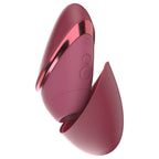 Womanizer Next Liberty Bordeaux avec son capuchon retiré, embout et boutons de commande visibles.