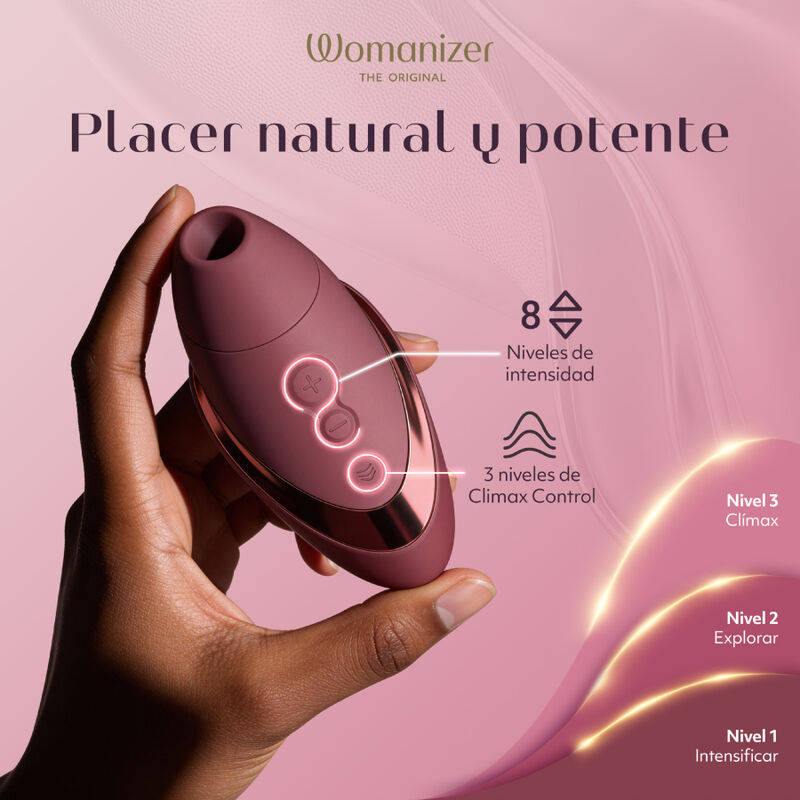 Womanizer Next Liberty Bordeaux tenu en main, avec un visuel des huit intensités et des réglages Climax Control.