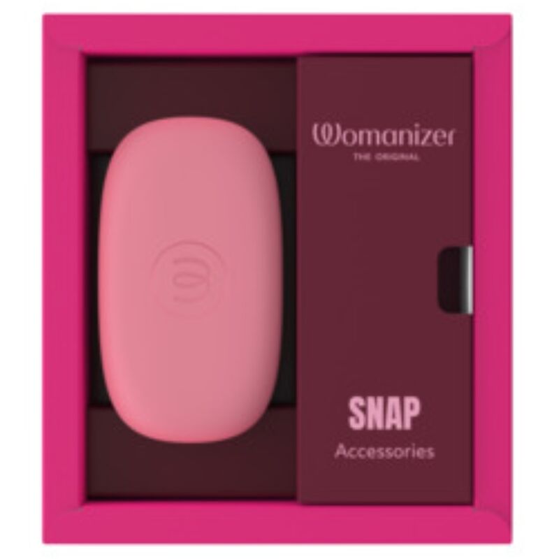 Coffret ouvert du Womanizer Snap Baie écrasée avec son étui rose et le compartiment d’accessoires.