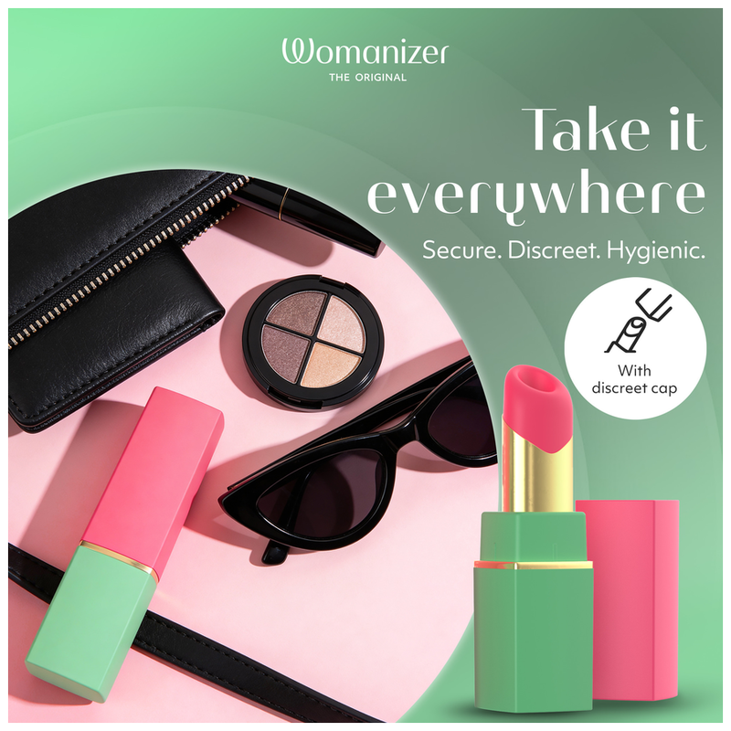 Womanizer Beauty vert et rose présenté avec une trousse et des accessoires de maquillage.