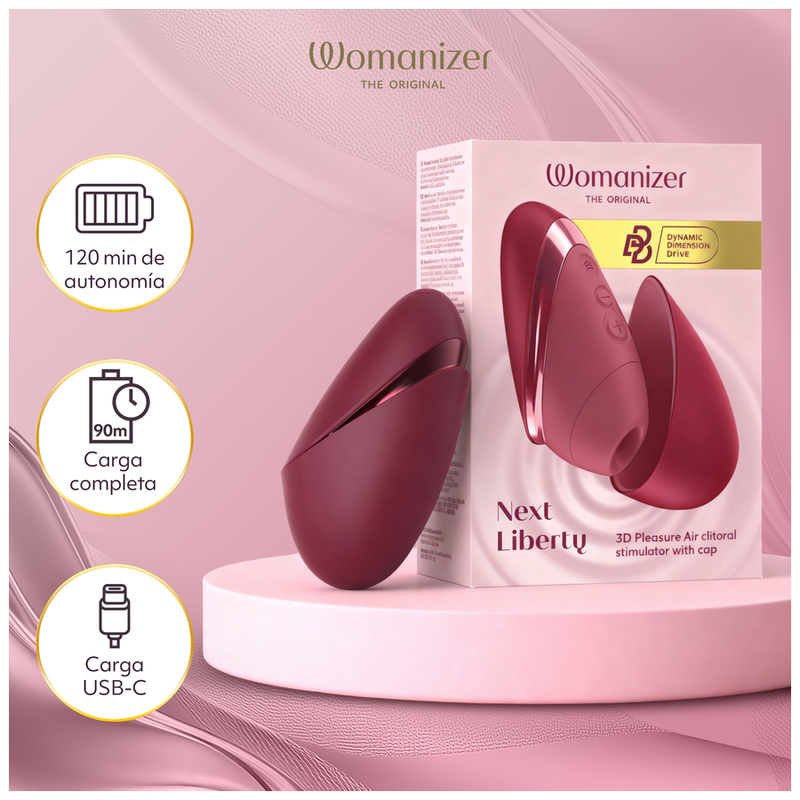 Womanizer Next Liberty Bordeaux ouvert et fermé devant son coffret, avec les indications de recharge USB-C.