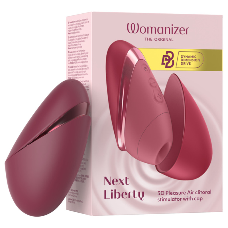 Womanizer Next Liberty Bordeaux fermé, présenté à côté de sa boîte rose illustrée.