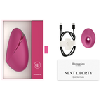 Coffret du Womanizer Next Liberty Rose avec câble USB-C, embout supplémentaire et guide de démarrage.