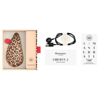 Coffret du Womanizer Liberty 2 Léopard avec câble de recharge magnétique, guide de démarrage et documents.