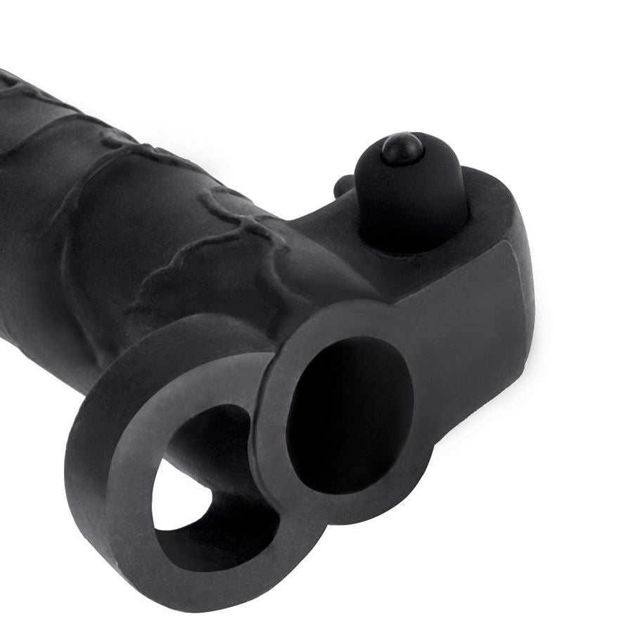 Gaine penienne vibrante noire vue de dessus, bullet a la base et double anneau extensible, gaine d'extension realiste a enfiler pour vibrer des deux cotes.