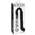 Boite Icicles du fouet a poignee en verre souffle et lanieres noires, accessoire faisant du manche en verre lisse un objet de discipline raffine.