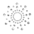 Cache-tetons bijou Mimi Bijoux Indiscrets en strass transparents disposes en rosace, decoration corporelle adhesive scintillante vendue par deux pour habiller les tetons