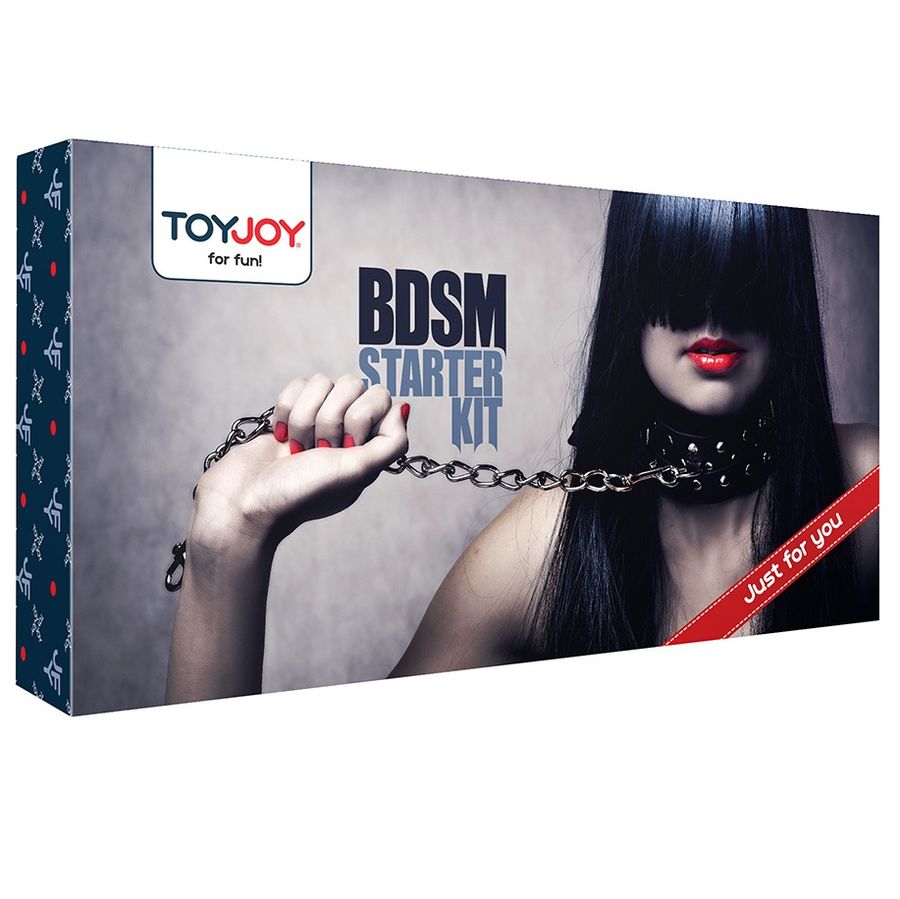 Boite du Kit BDSM Starter Toy Joy : visuel d'un modele aux levres rouges tenant une chaine, packaging gris et rouge de coffret initiation couple
