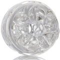 Masturbateur compact ouvert aux deux extremites, gaine transparente vue de face sur l'ouverture en etoile et la texture interne en spirale, fond blanc.