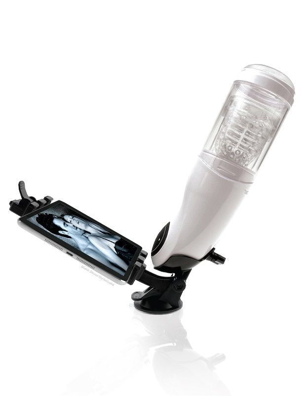 Masturbateur PDX Mega Bator fixé par ventouse sur une surface plane, support à pince tenant un téléphone avec image à l'écran, vue en angle avec reflet au sol.