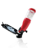 Masturbateur PDX Mega Bator rouge fixé par ventouse, support à pince tenant un téléphone avec image à l'écran, vue en angle avec reflet au sol.