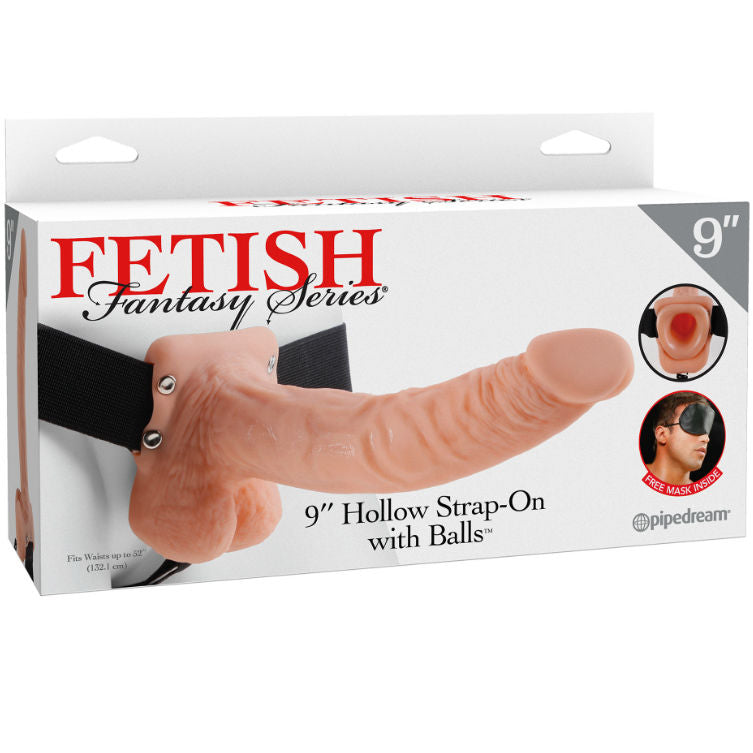 Gode ceinture creux realiste teinte chair sur harnais noir dresse, gland net, fut veine et testicules moules, vue de profil, modele Fetish Fantasy effet peau, sangles elastiques ajustables.
