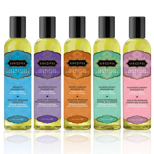 Gamme Kamasutra Aromatics alignee de cinq flacons d'huile de massage aux couleurs differentes, melanges aromatiques parfumes pour un massage sensuel a deux.