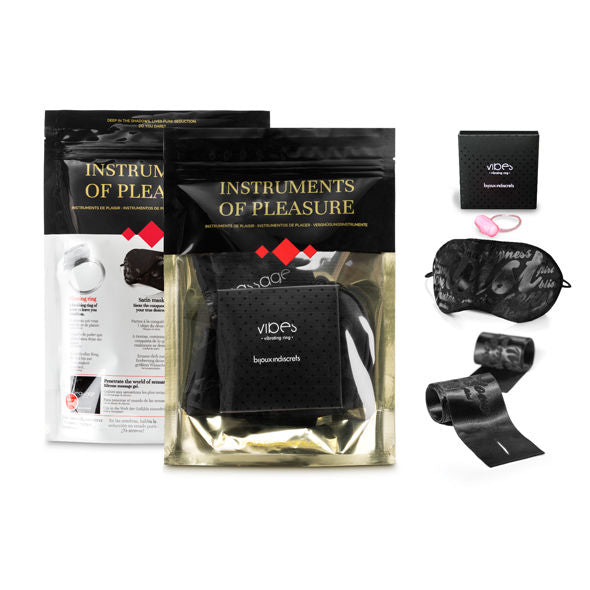 Composition du coffret Instruments de Plaisir Bijoux Indiscrets : pochettes, anneau vibrant, masque satin et menottes textiles pour la domination douce à deux.