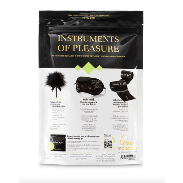 Verso de la pochette Instruments of Pleasure du coffret BDSM satin Bijoux Indiscrets présentant masque, menottes et duster pour la domination sensuelle à deux.