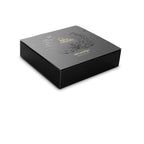 Coffret noir laque Desir Metallique Bijoux Indiscrets, ecrin elegant du tour de cou bijou en maille metallique, packaging sophistique aux motifs floraux dores