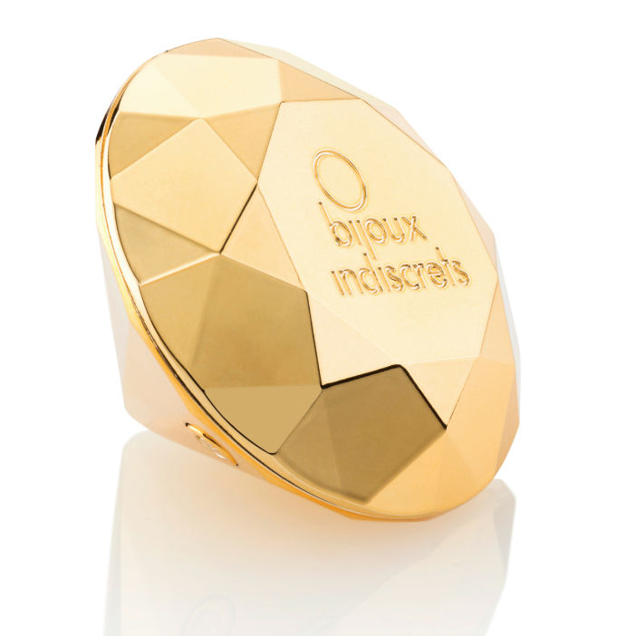 Stimulateur clitoridien Twenty One Bijoux Indiscrets, galet diamant dore vu de profil sur ses facettes brillantes, mini vibromasseur submersible et rechargeable.