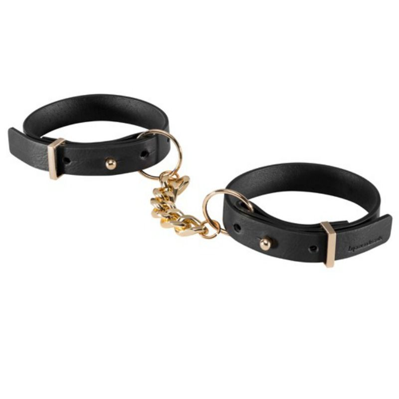 Menottes bracelets Maze Bijoux Indiscrets en polyurethane vegan recycle, paire reliee par une chaine doree, presentee a plat, accessoire mode et soft bondage reglable.