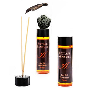 Coffret Extase Sensual Hot Oil Extra Fresh mangue avec batonnets d'encens et support fleur, deux flacons orange effet chaud-froid pour une ambiance massage sensorielle gourmande.