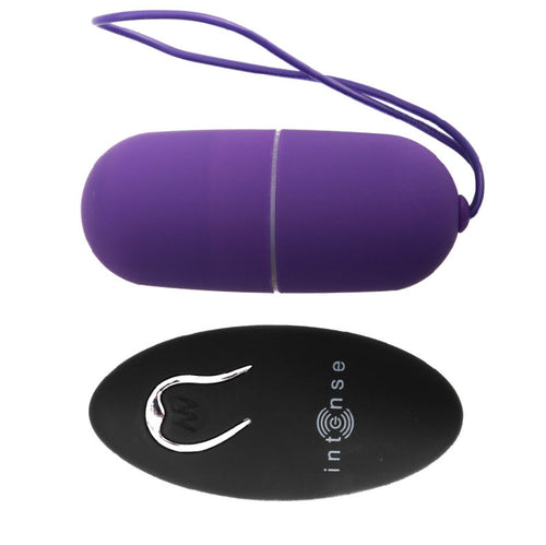 Oeuf vibrant Flippy Egg I violet en silicone avec lanette de retrait et telecommande ovale noire Intense, surface lisse, sextoy interne discret sur piles