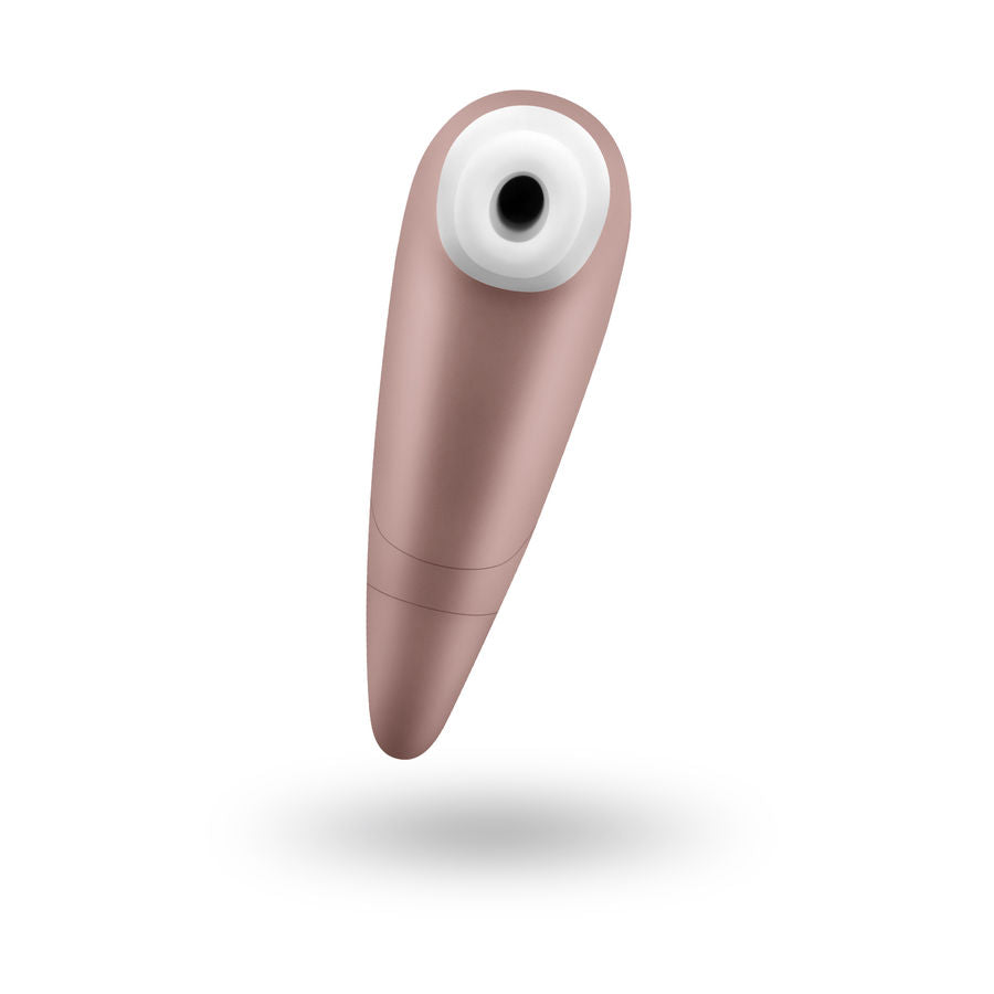 Stimulateur clitoridien dore vu de face, ouverture d'aspiration entouree de silicone blanc, technologie ondes de pression sans contact, 11 programmes, etanche et discret.