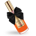 Huile de massage chauffante Light My Fire Bijoux Indiscrets, flacon orange a noeud satin noir et bouchon dore, arome fraise des bois comestible a effet thermique.