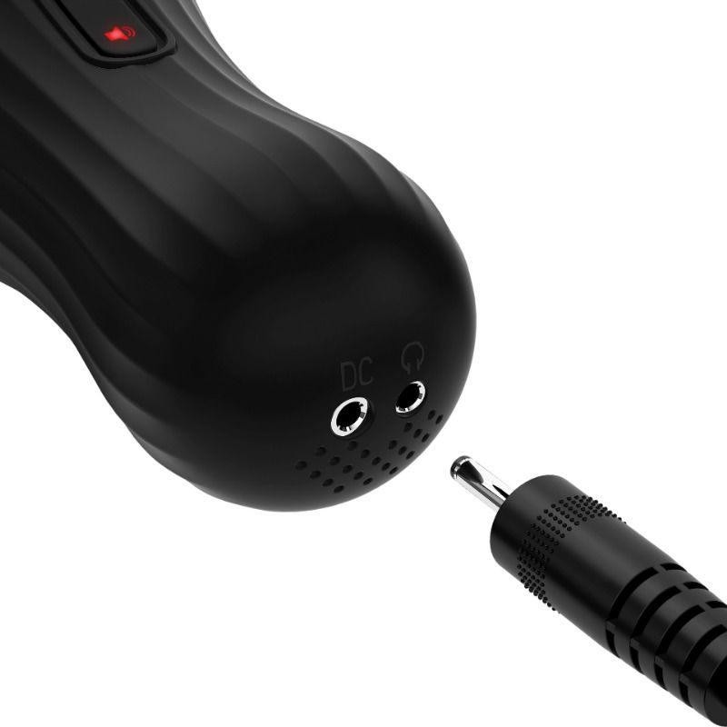 Gros plan sur l'embout inférieur du rotobateur avec prise casque et prise de charge DC, câble de recharge présenté à côté