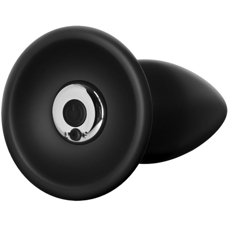 Petit plug anal en silicone noir vu sous l'angle de la base révélant le logement métallique du moteur, format compact et conique de ce stimulateur vibrant rechargeable.
