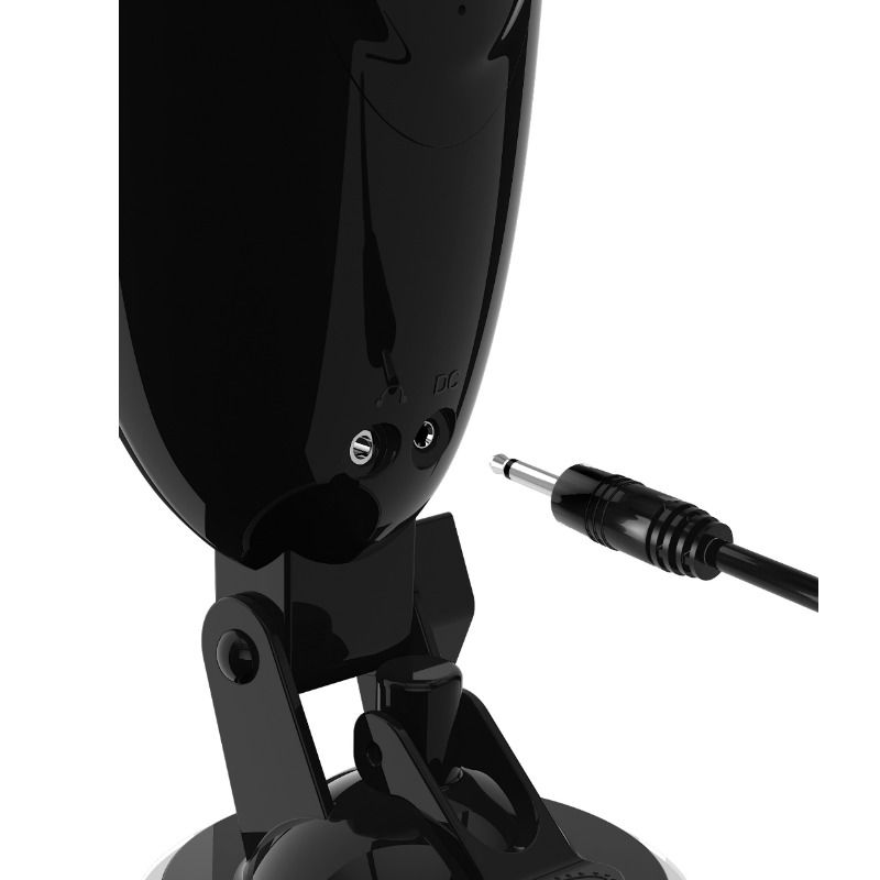 Gros plan sur la ventouse articulée et les prises casque/charge à la base de l'appareil, câble de recharge présenté à côté