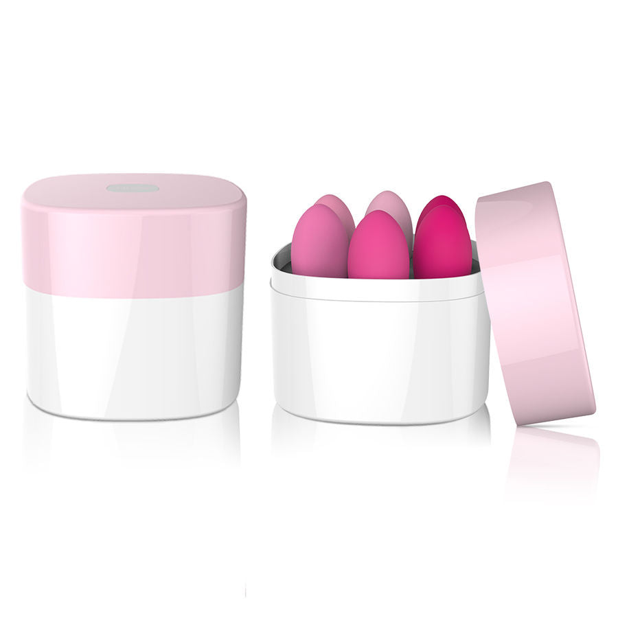 Pot de rangement cylindrique blanc et rose ouvert et ferme, contenant le set de boules de Geisha en silicone Leslie pour un stockage discret et hygienique