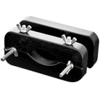 Presse-testicules en bois laque noir vu deux blocs rapproches avec vis papillon de serrage lateral, accessoire de domination metallique sur fond blanc.